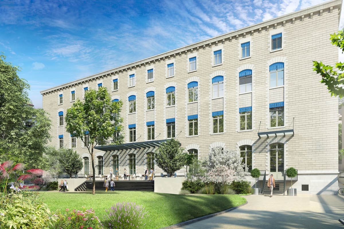 Réhabilitation d'une ancienne école en programme mixte